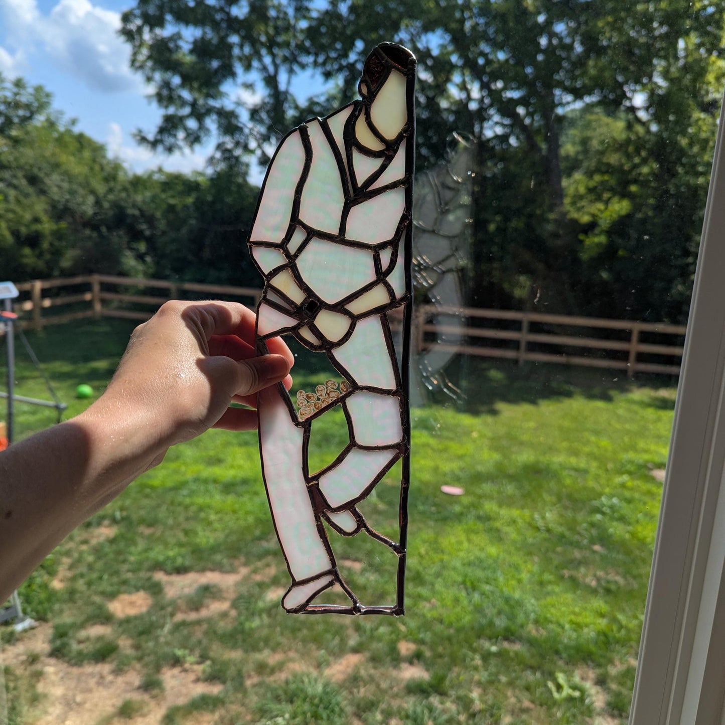 Preorder: Suncatcher of Kellan Lutz holding a bag of eggs