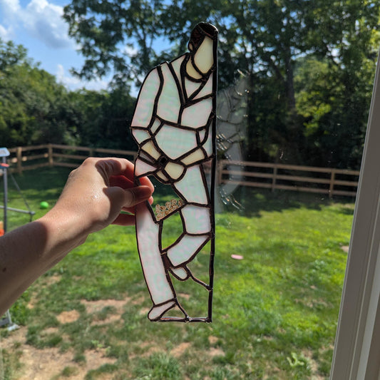 Preorder: Suncatcher of Kellan Lutz holding a bag of eggs