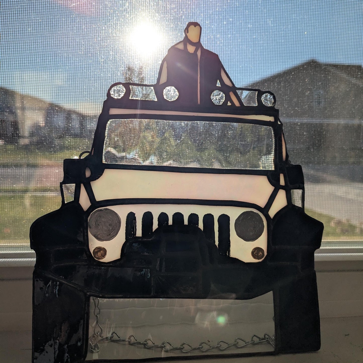 Sun Catcher of Emmett in his Jeep